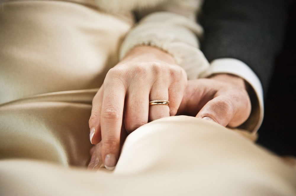 Bride and Groom Holding Hands