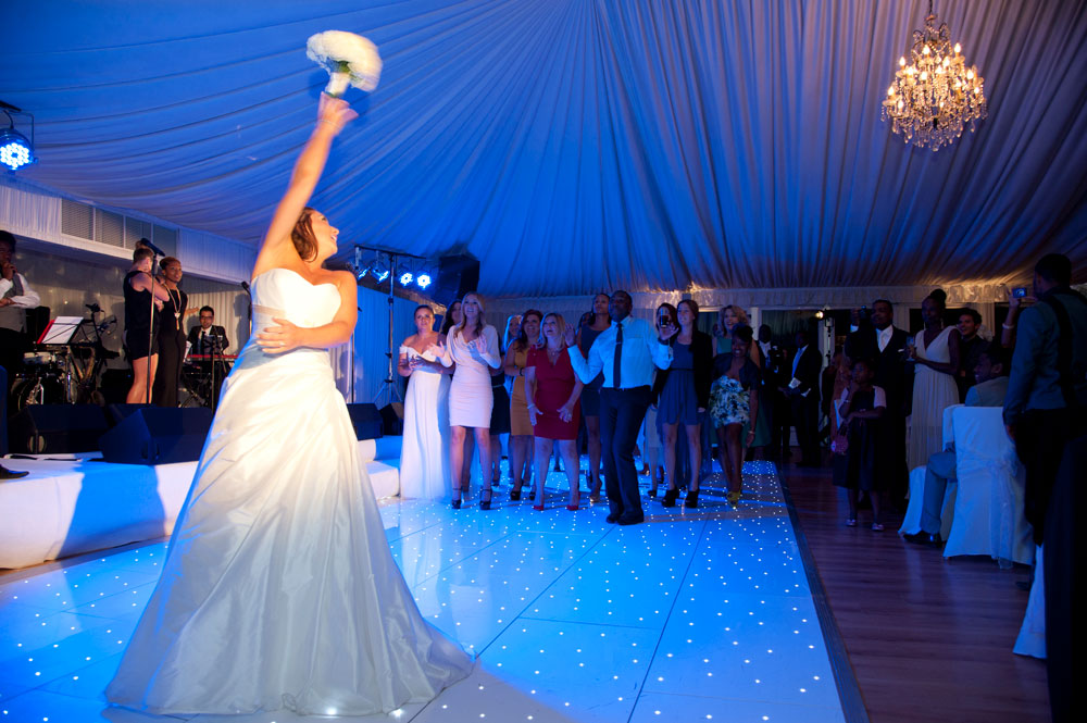 Bride tossing the wedding bouquet