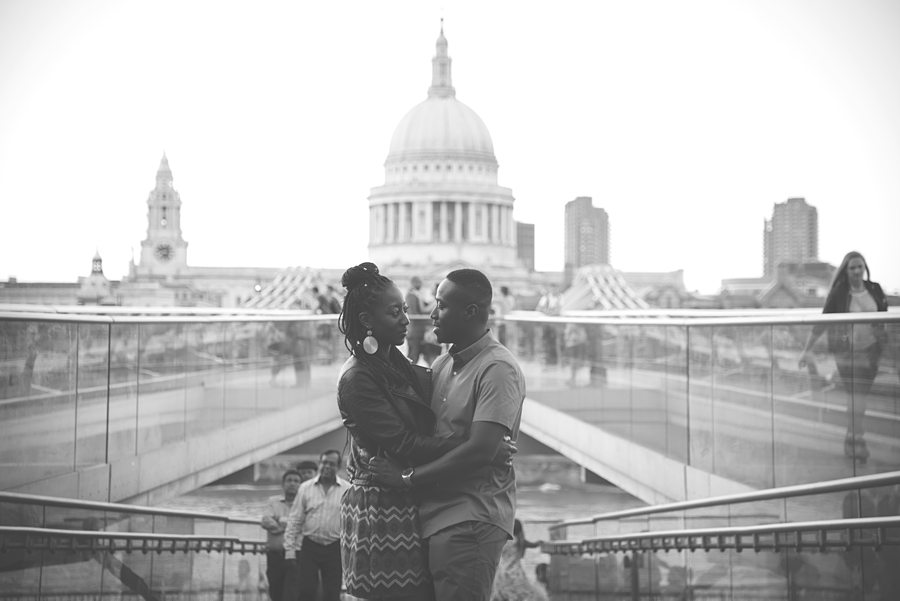 Couple with arms around each other on the Millennium Bridge