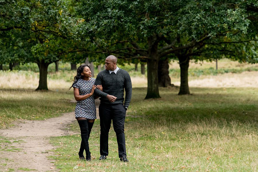 Couple walking with linked arms