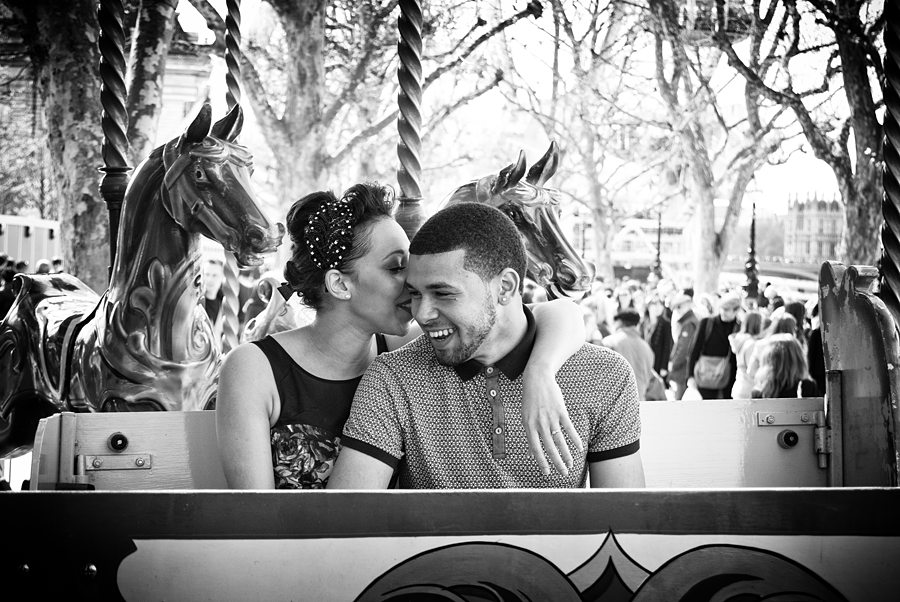 Couple laughing on carousel
