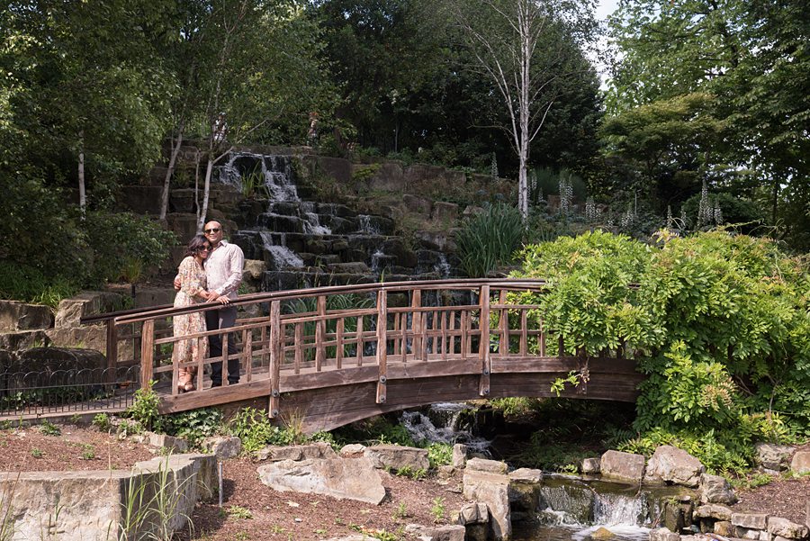 Couple hugging on bridge
