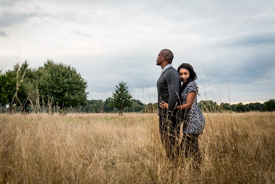 Couple hugging in long grass