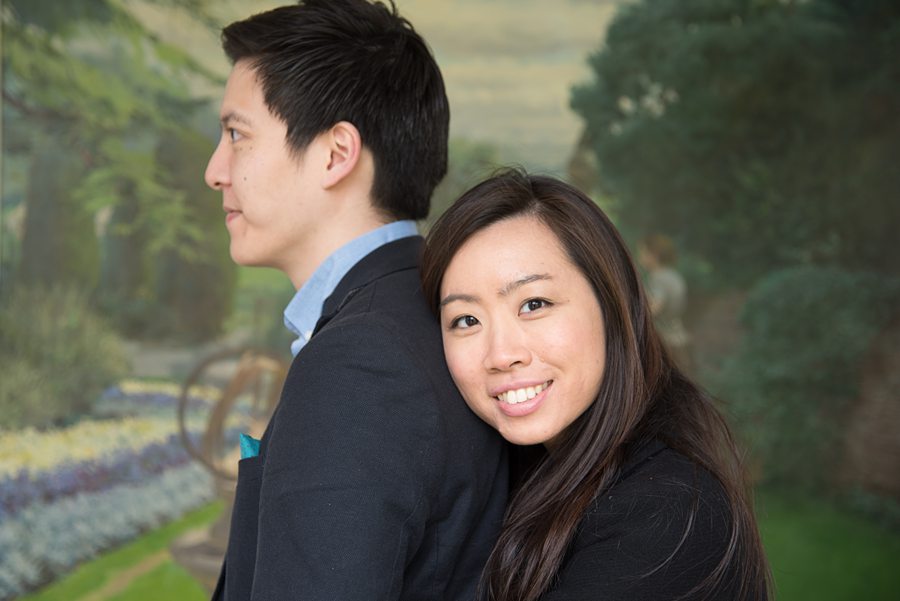 Couple with woman hugging man from behind