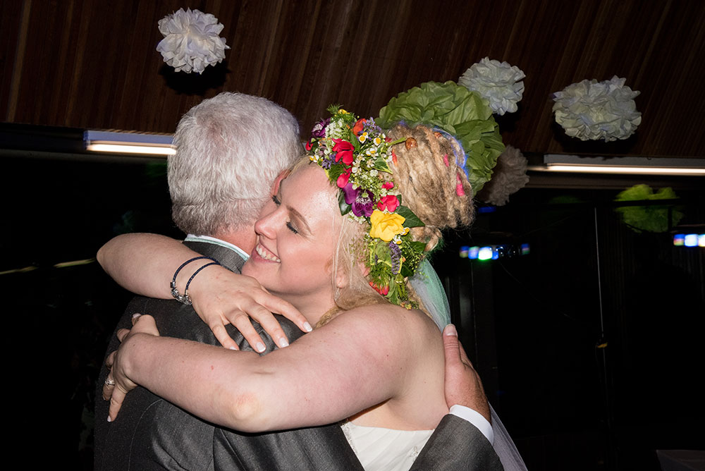 Bride hugging father on the dancefloor