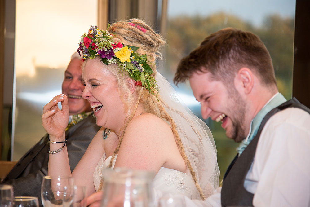 Bride laughing during speeches