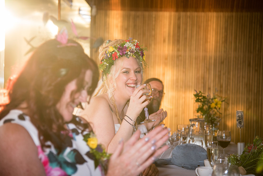 Bride laughing during the speeches