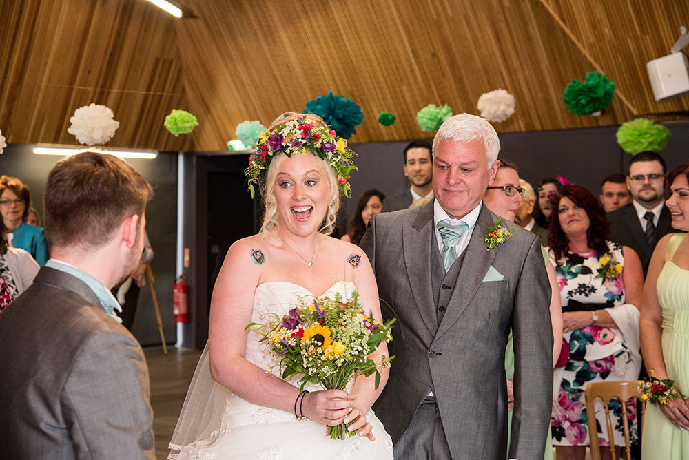 Bride reacting to seeing groom at the altar