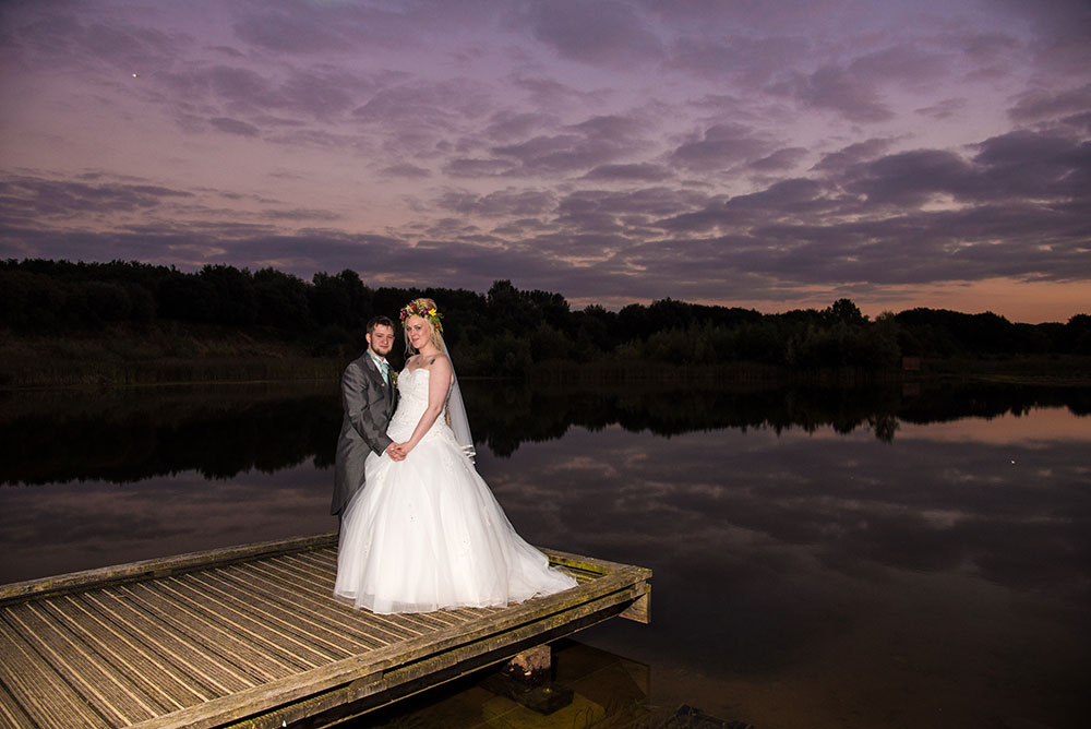 Couple on the jetty at sunset
