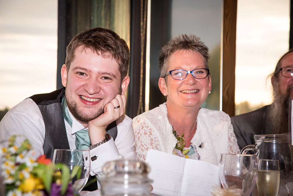 Groom smiling during speeches