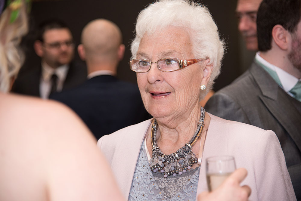 Guest after the wedding talking to the bride