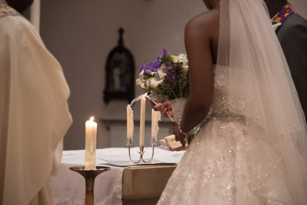 Bride and groom lighting candles