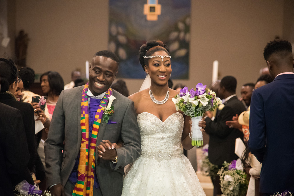 Bride and groom walking down the aisle after the ceremony