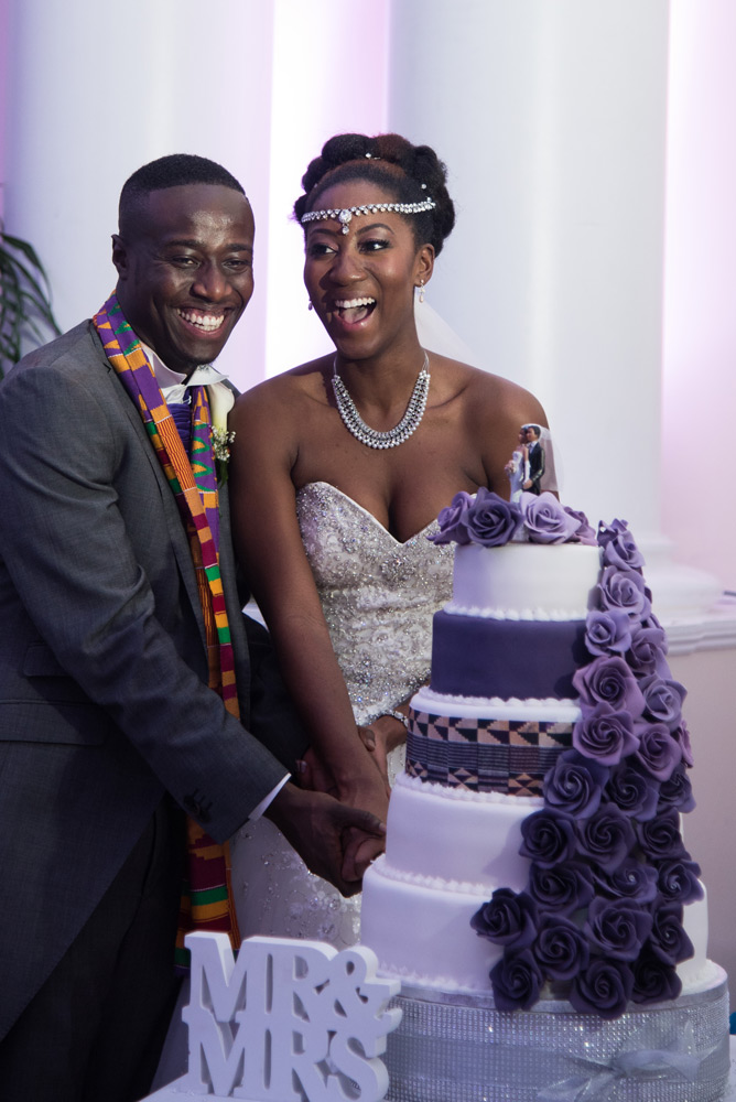 Bride and groom cutting the cake