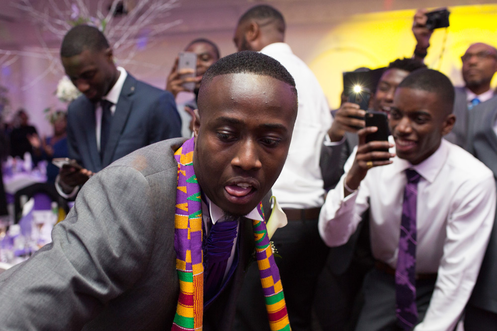 Groom&rsquo;s face as he dances into reception room
