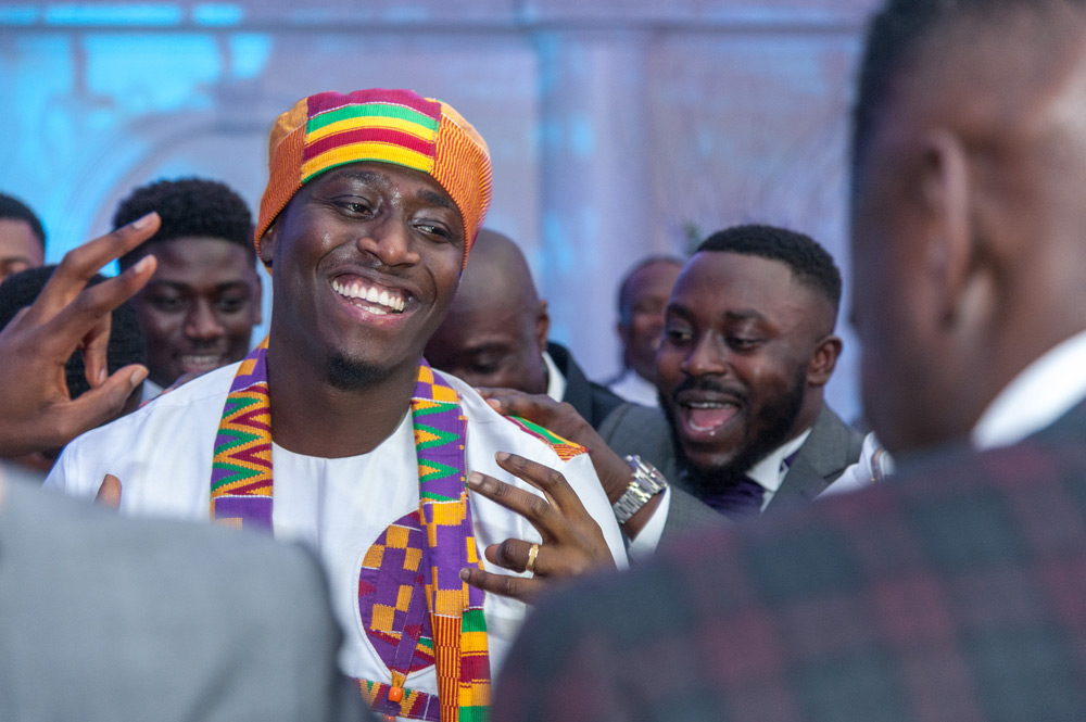 Groom surrounded by friends