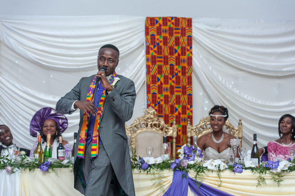 Groom in front of top table during his speech