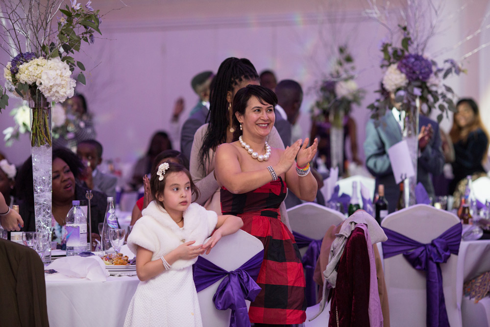 Guests welcoming couple into reception room