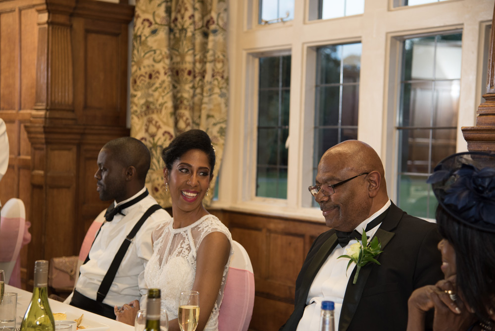 Bride looking at father during speeches