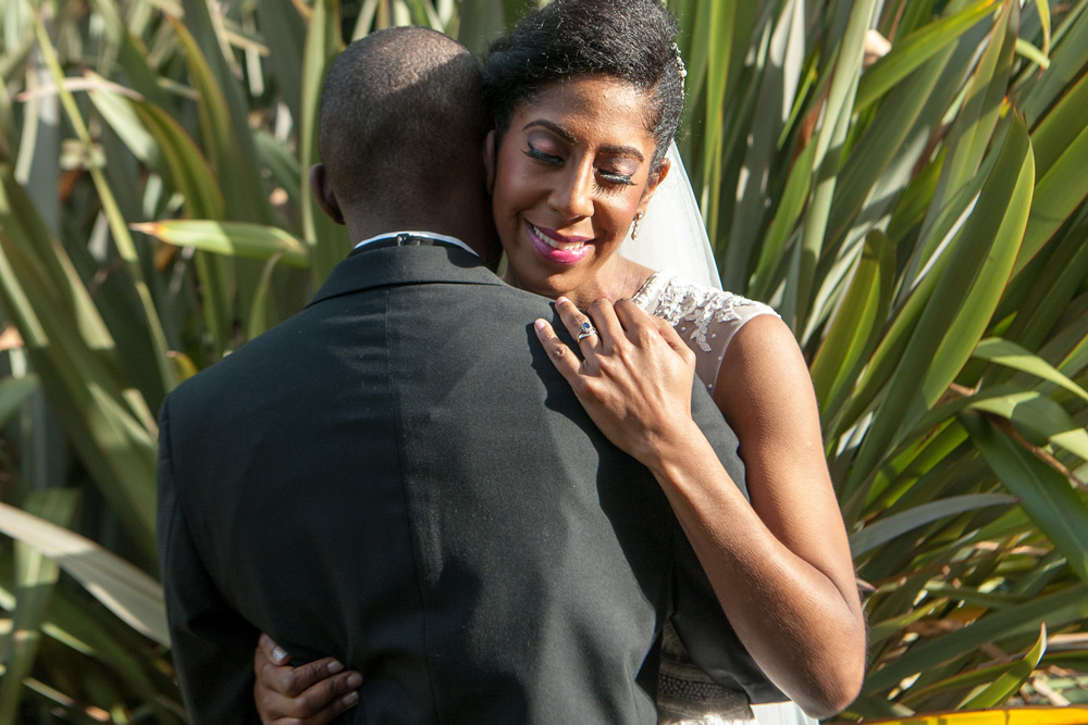 Couple hugging in gardens
