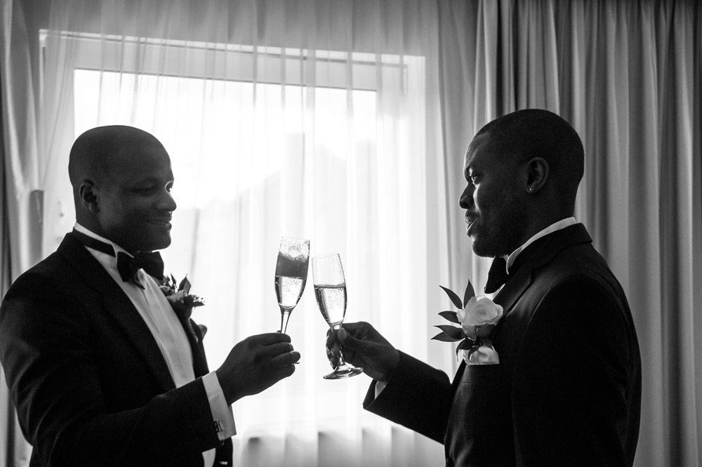 Best man and groom toasting