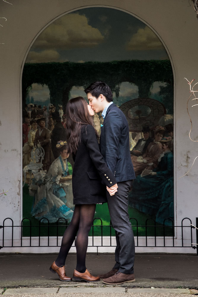 Couple holding hands and kissing