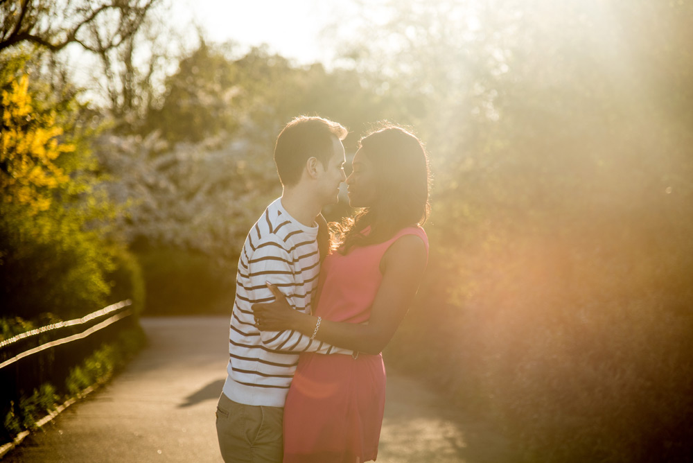 Couple kissing in Regent’s Park during sun set