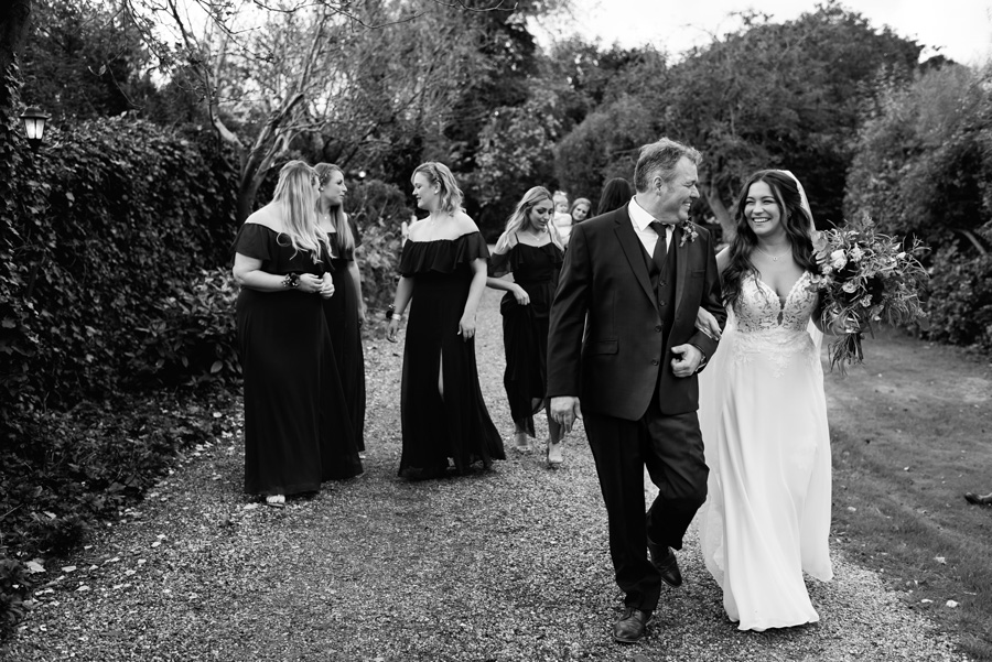 Essex wedding party walking to ceremony
