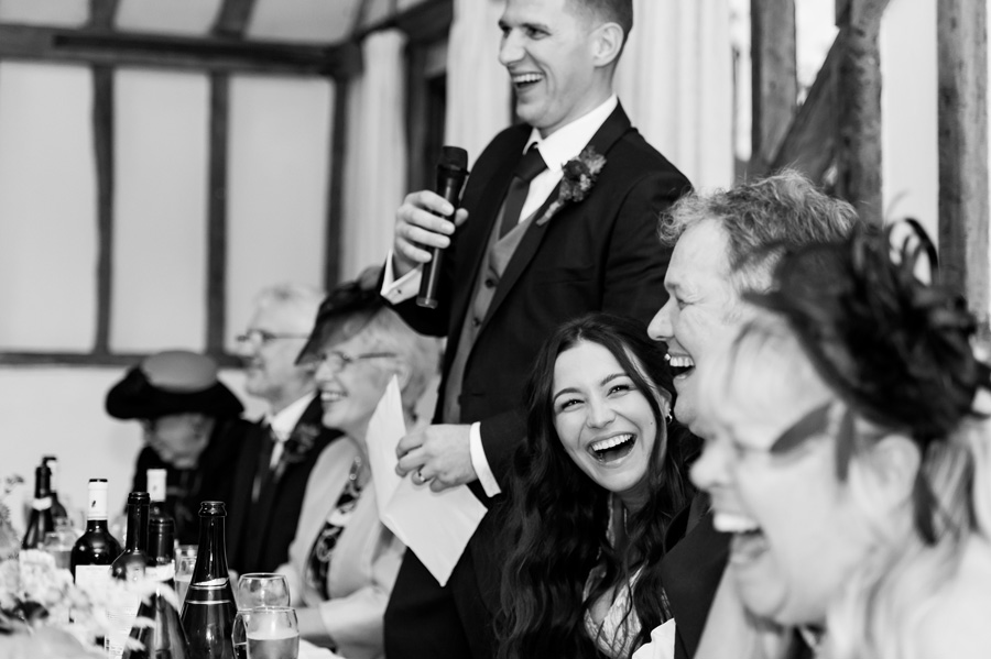 Bride reacting to groom&rsquo;s speech at essex wedding