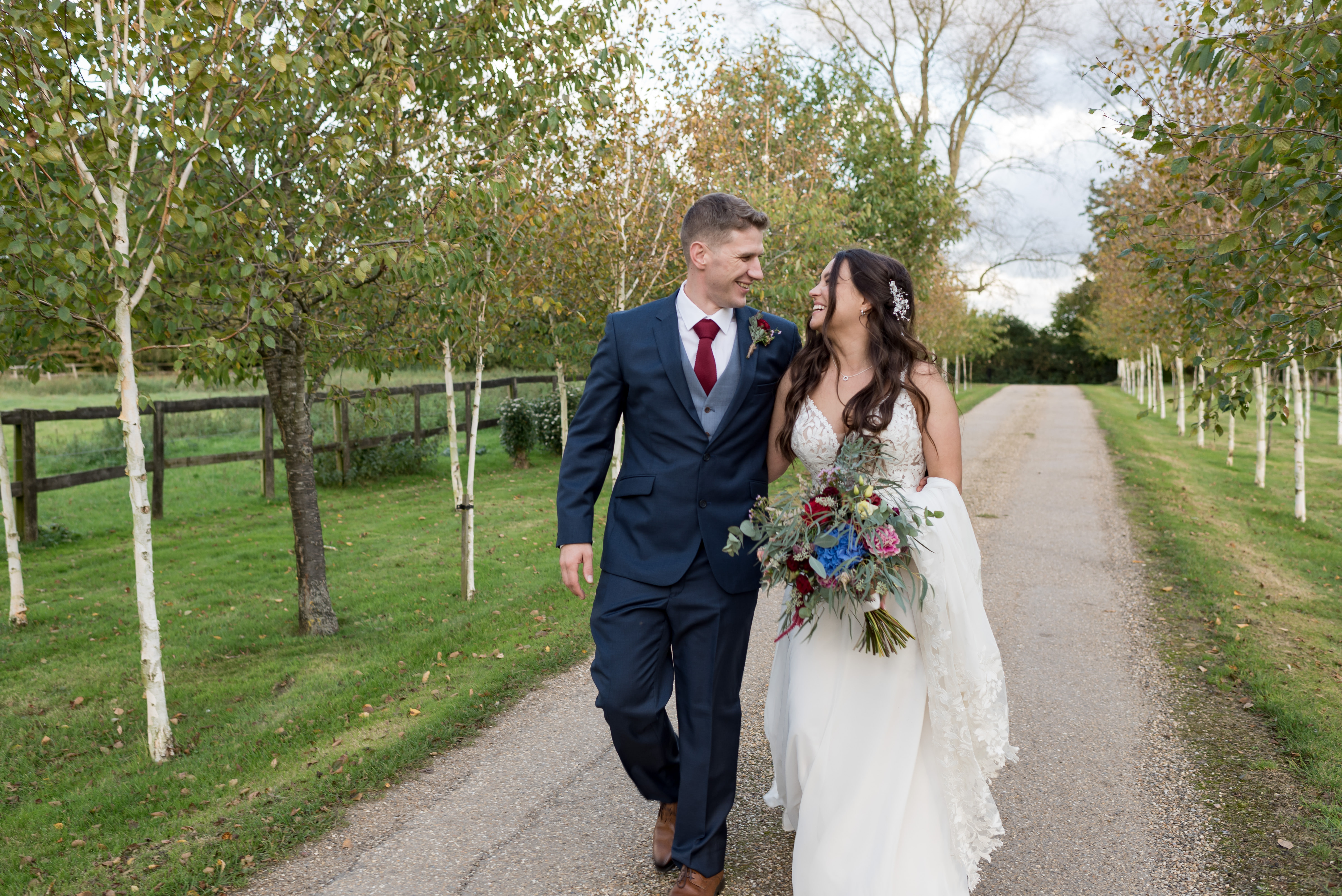Essex wedding couple laughing while walking