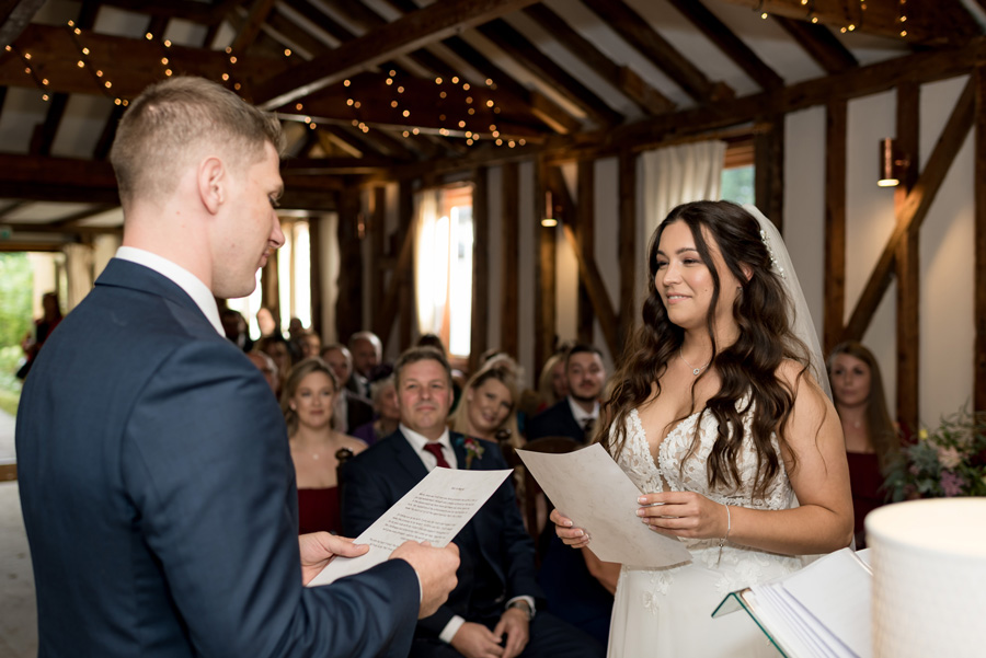 Couple reading their vows to eachother