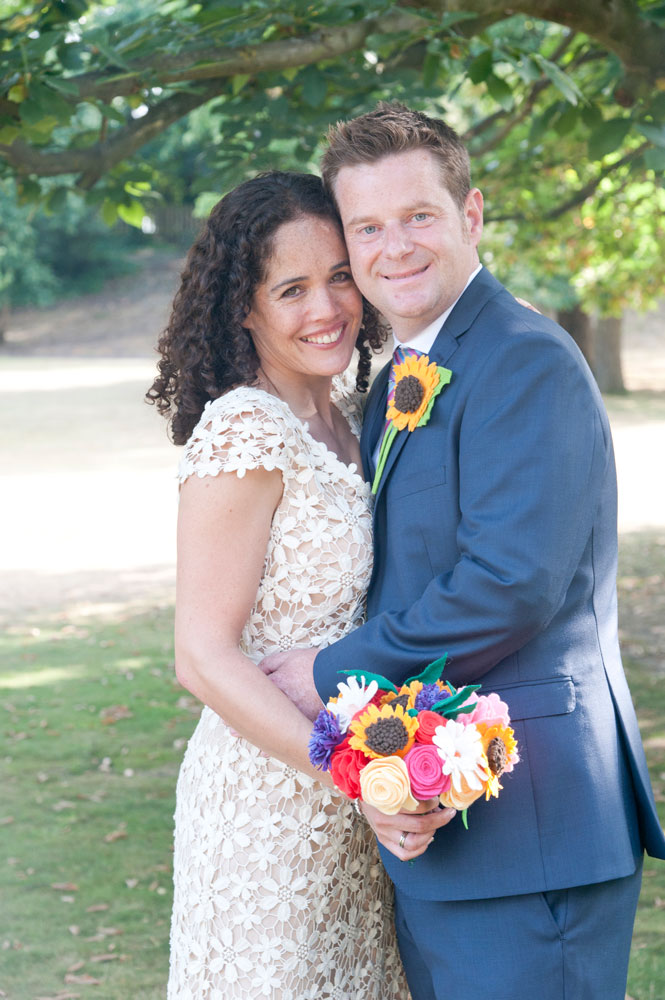 Couple hugging while looking at the camera