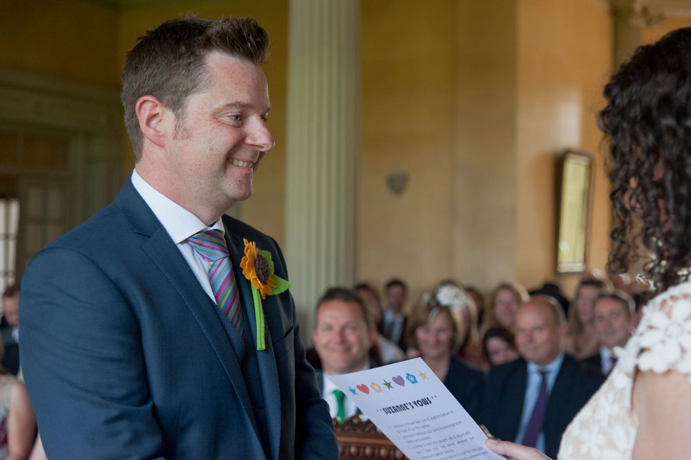 Groom listening to the bride say her vows