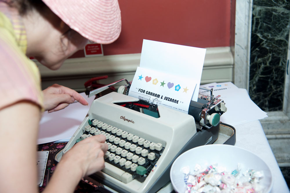 Guest using typewriter to leave couple message