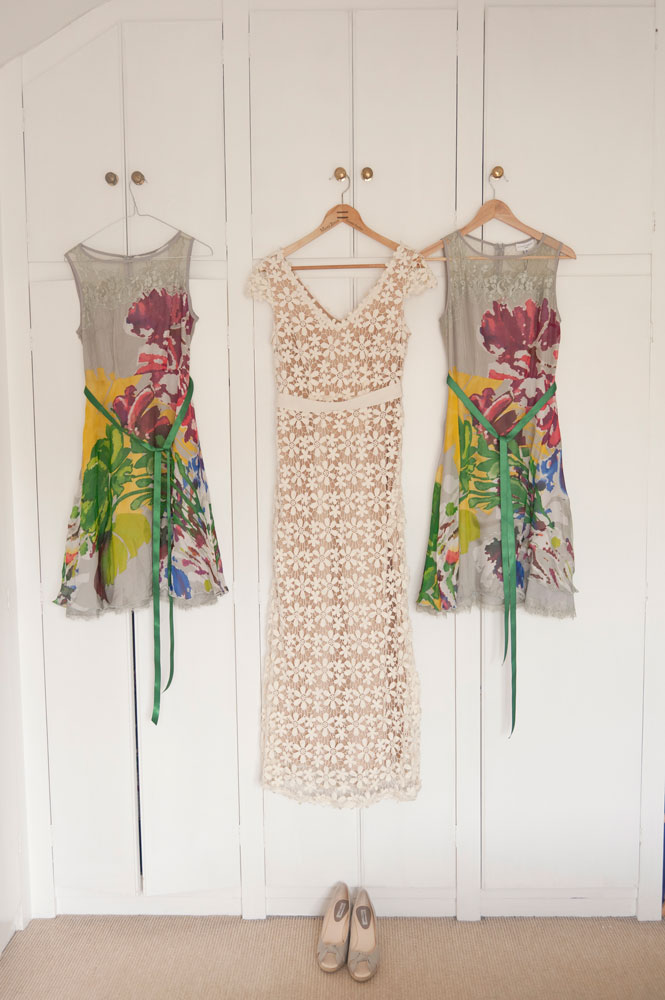 Bride&rsquo;s and bridesmaid&rsquo;s dresses hanging up