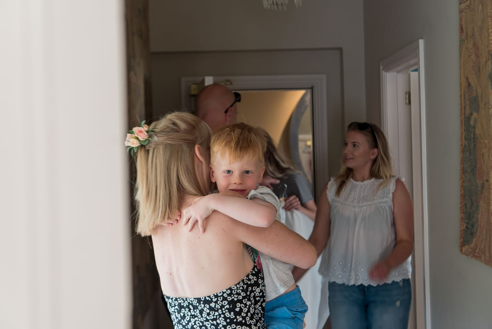 Bride hugging her son