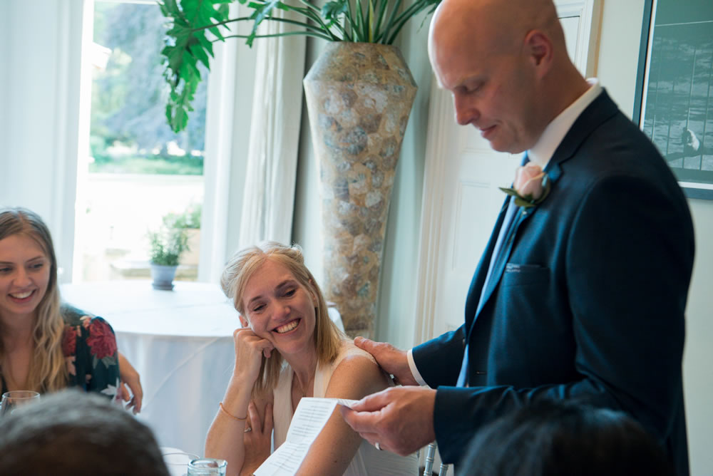 Bride looking at groom during his speech