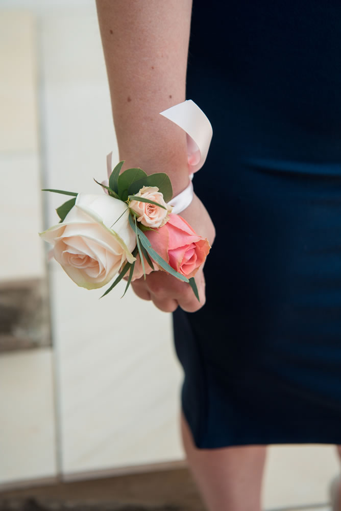 Corsage on bridesmaid’s wrist