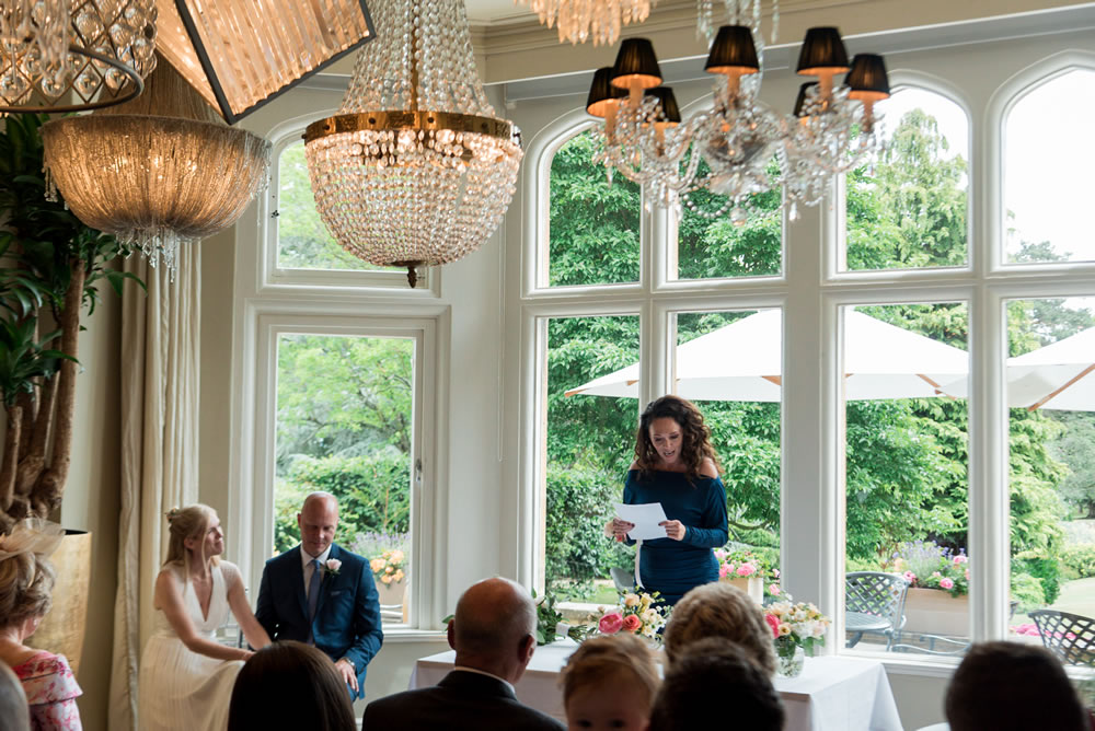 Bridesmaid reading during ceremony