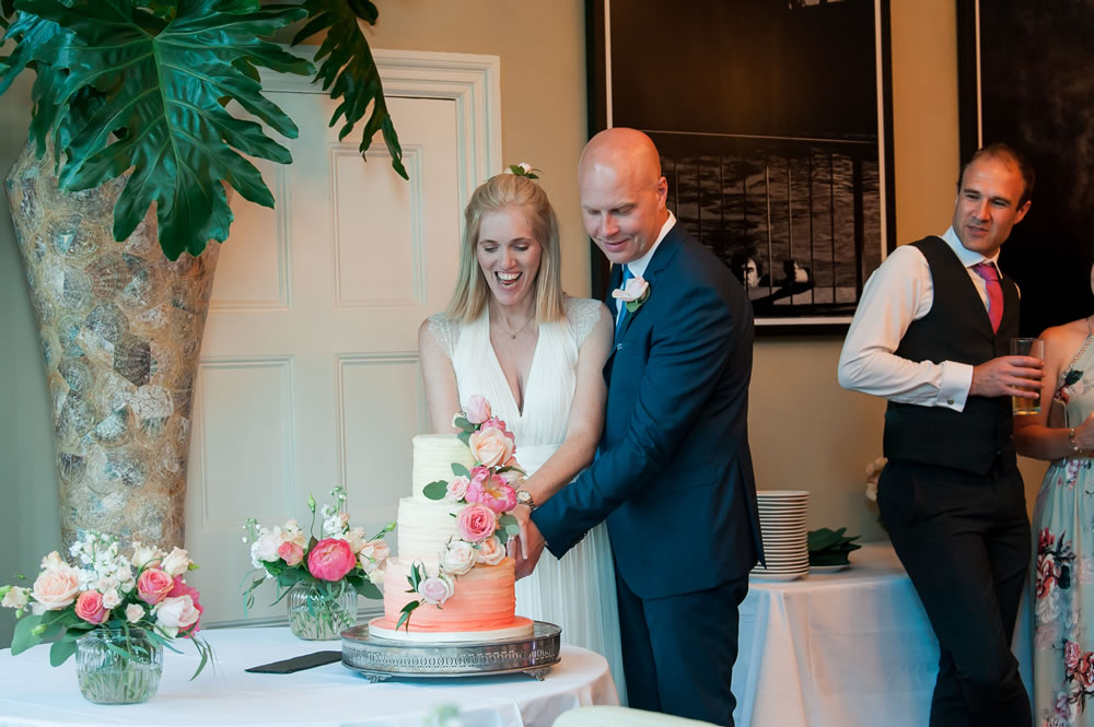 Couple cutting their wedding cake