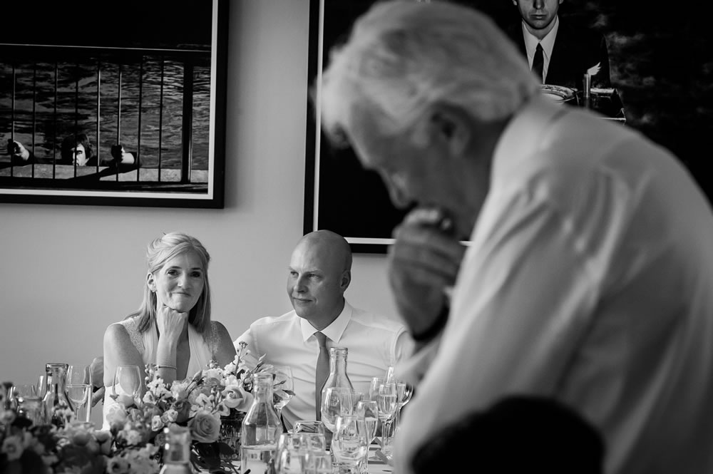 Couple listening to father of the bride’s speech