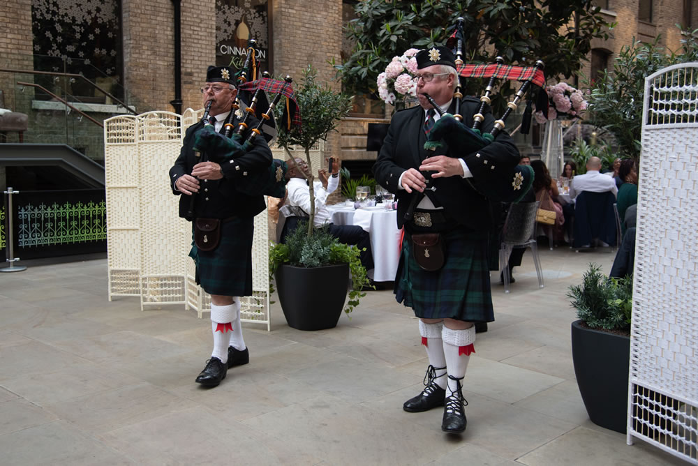 Bagpipers and drummer leaving reception