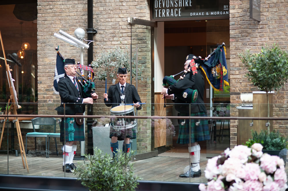 Bagpipers and drummer playing at reception