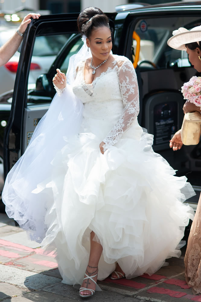 Bride stepping out of the taxi
