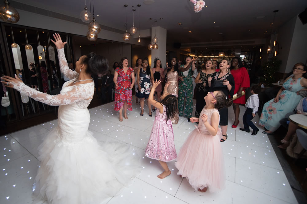Bride tossing the bouquet