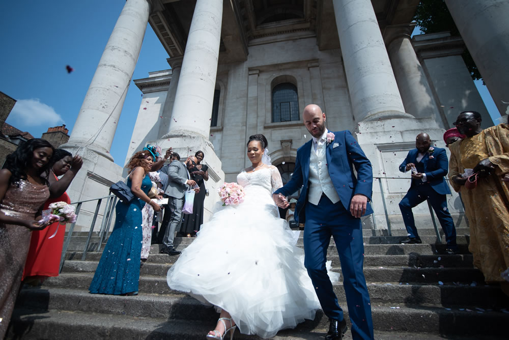 Couple walking down steps of church