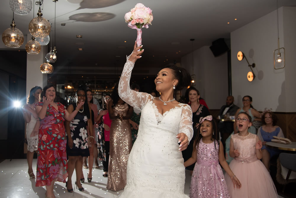 Bride tossing the bouquet