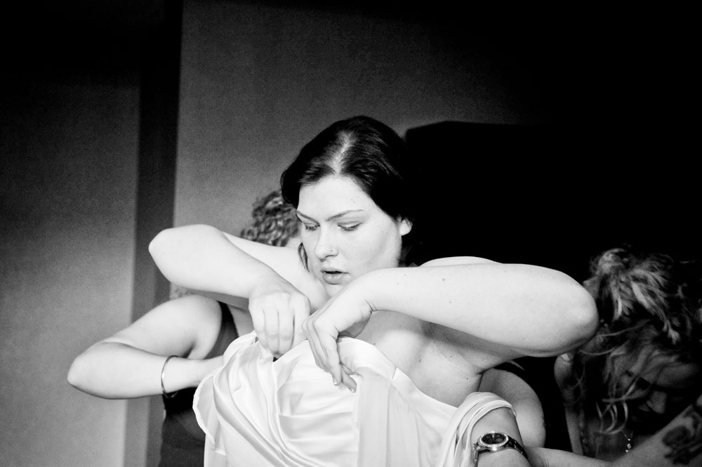 Bride getting into her dress