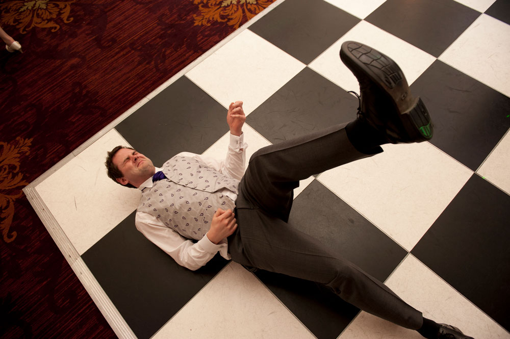 Guy air guitaring on dancefloor