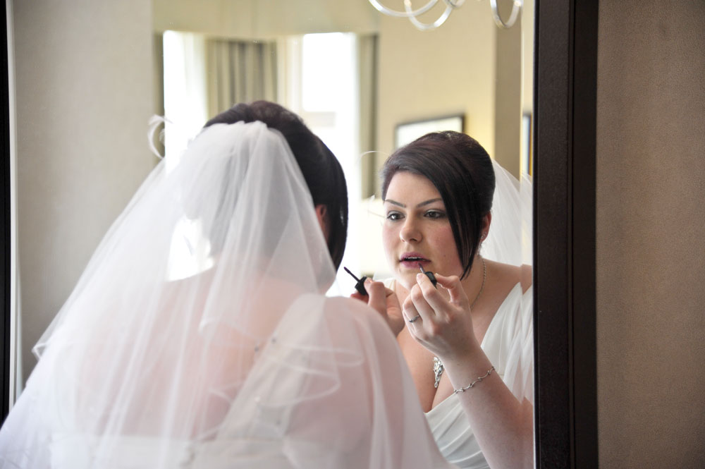 Bride touching up her make up